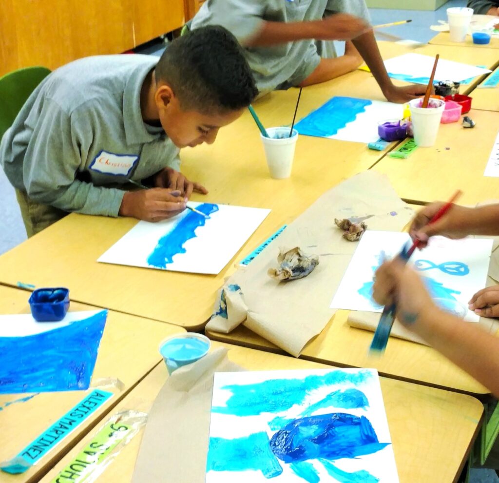 student creating art painting what blue means to him