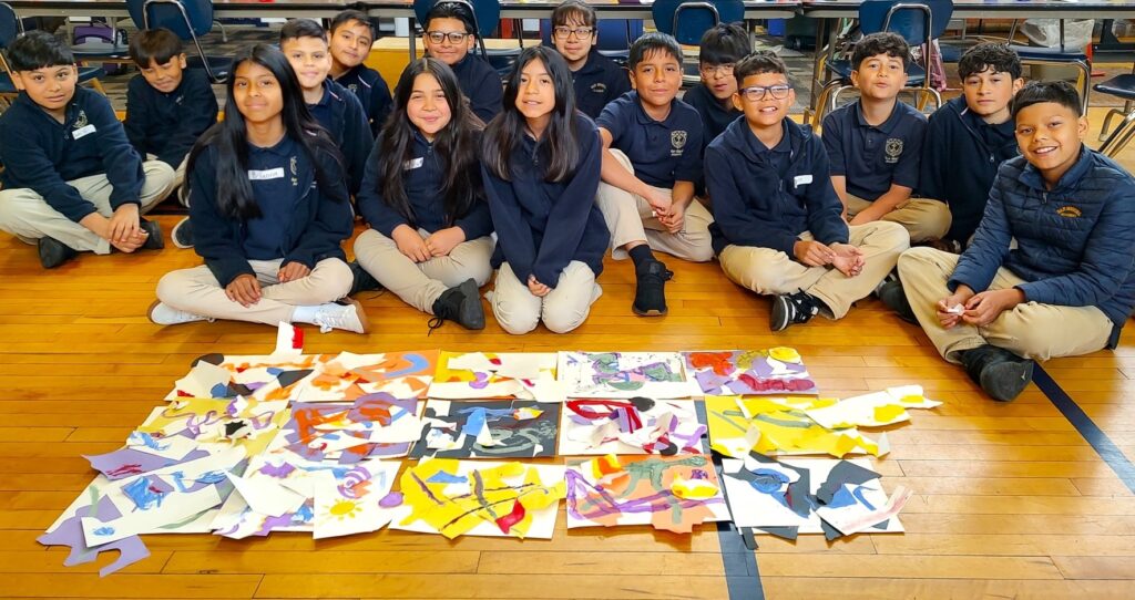 SMA students with collaborative art piece that they created.